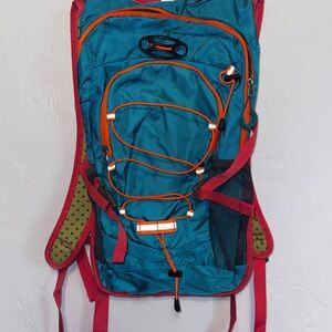 Vibrant Teal Backpack with Red and Orange Details